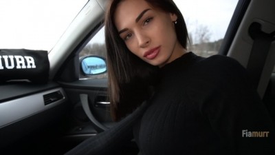 The brunette's doing her thing in the car